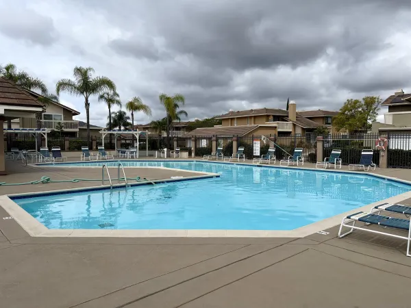 a view of swimming pool with outdoor seating