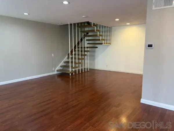 a view of entryway with wooden floor