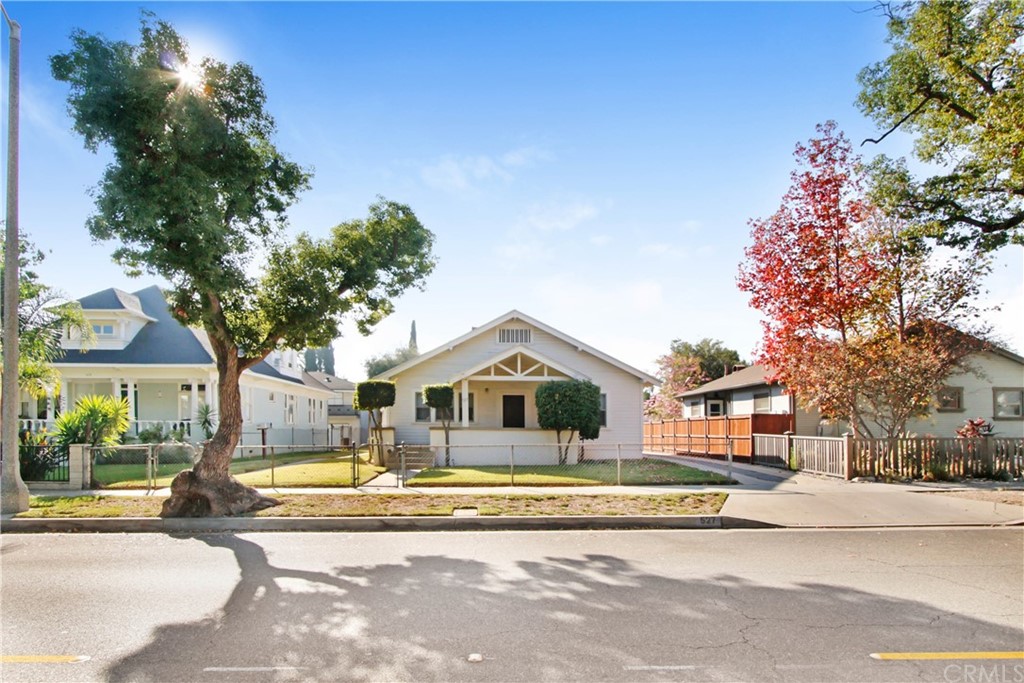 523 Lincoln Avenue Pasadena, CA 91103 - Photo 1 of 24 a view of a white house with a large tree and plants