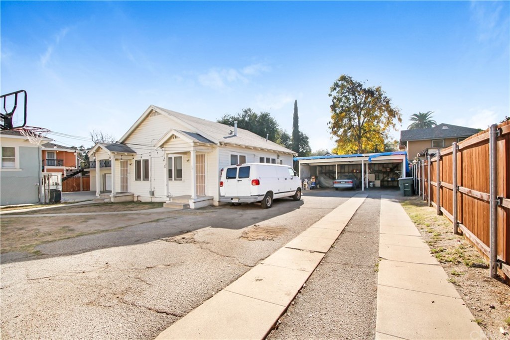 523 Lincoln Avenue Pasadena, CA 91103 - Photo 17 of 24 a view of a white house with a yard