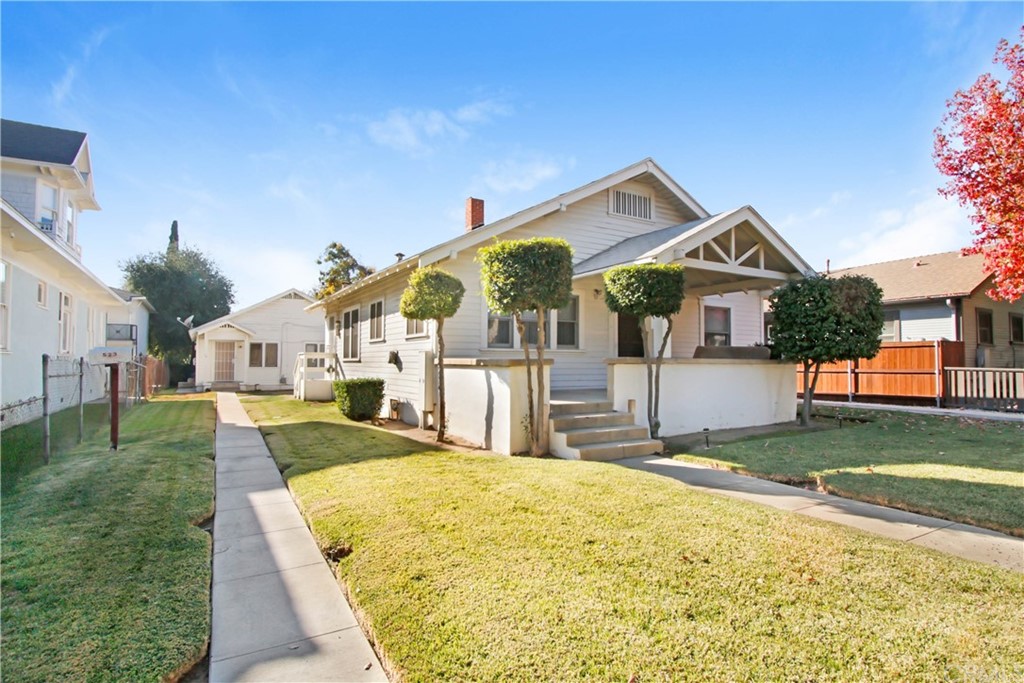 523 Lincoln Avenue Pasadena, CA 91103 - Photo 3 of 24 a front view of a house with a yard and garage