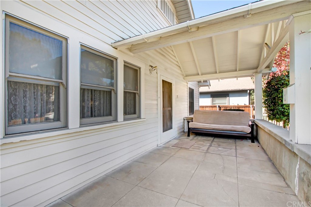523 Lincoln Avenue Pasadena, CA 91103 - Photo 4 of 24 a view of a porch with wooden floor and a potted plant