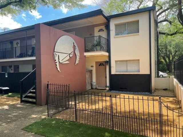 a view of a house with a iron gate