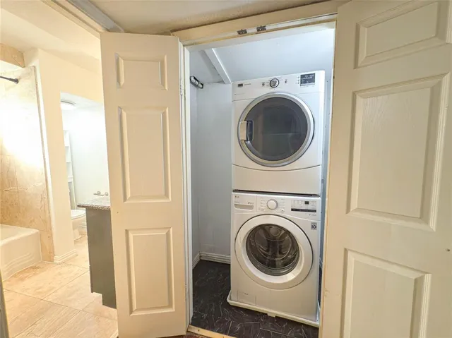 a view of a hallway with washer and dryer