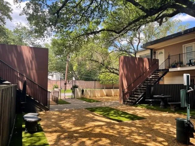 a view of a street with the trees in the background