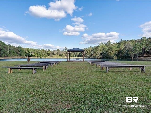 4650 Wiggins Lane Wilmer, AL 36587 - Photo 32 of 66 View of property's community with a lawn, a gazebo, a water view, and a wooded view