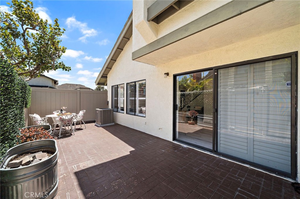 18134 Rustic Court Fountain Valley, CA 92708 - Photo 32 of 40 Nice patio with pavers and PVC fencing