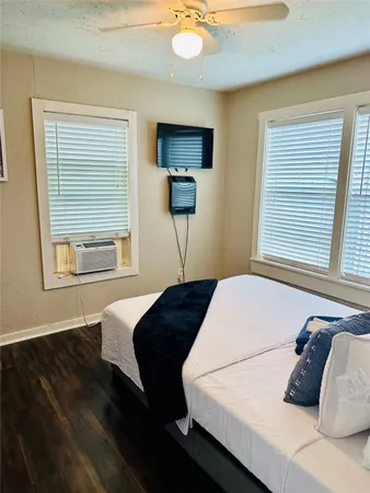 a bedroom with a large bed and a window