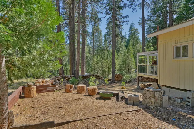 a view of a backyard with sitting area