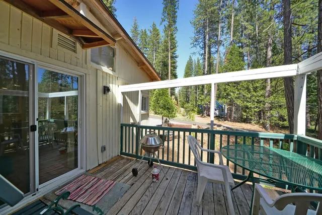 a view of a balcony with wooden floor