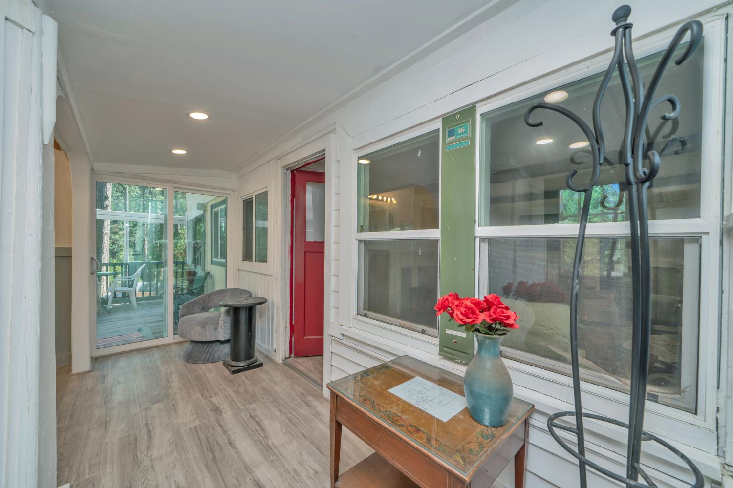 1334 School Road Kyburz, CA 95720 - Photo 6 of 36 a living room with furniture and a floor to ceiling window