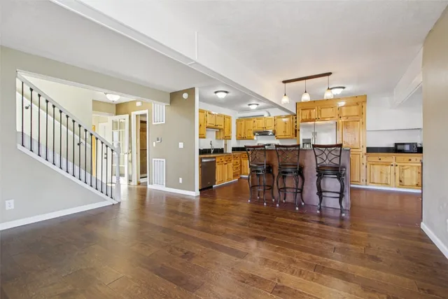 a view of a dining area with furniture and wooden floor