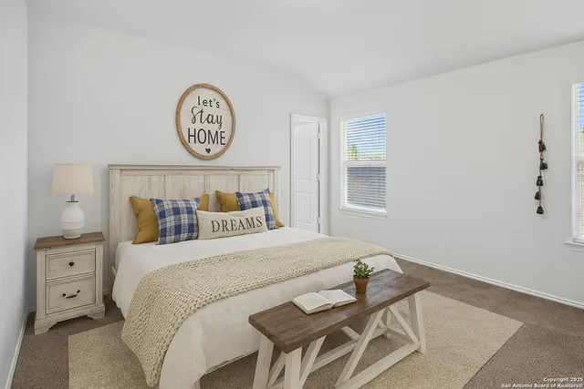 a bedroom with a bed and a table