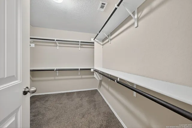 a view of an empty walk in closet
