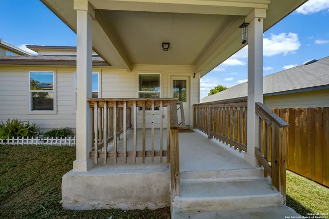 a view of a porch with wooden floor