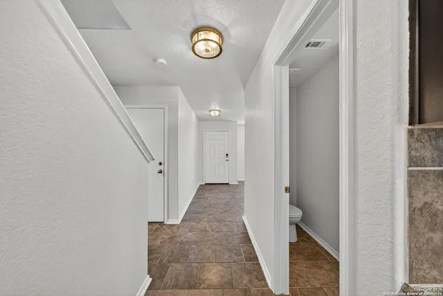 a view of a hallway with entryway