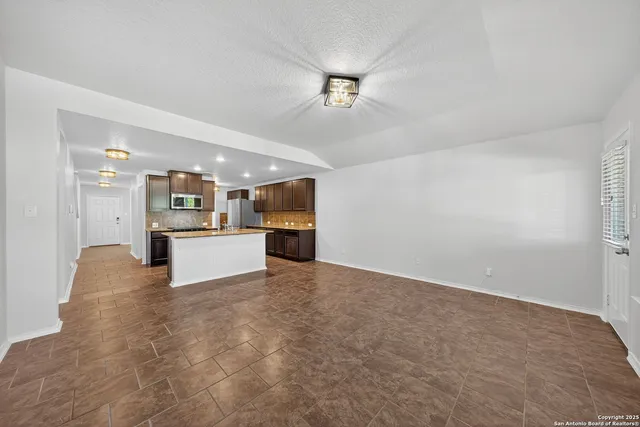 a view of kitchen and kitchen with a sink
