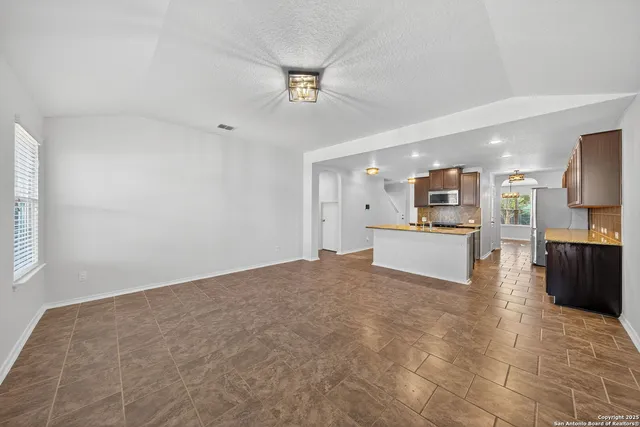 a view of a kitchen with a sink
