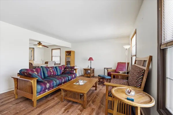 a living room with furniture a flat screen tv and a couch