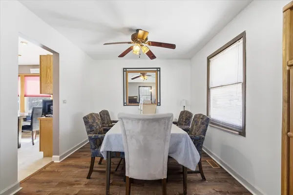 a view of a dining room with furniture window and wooden floor