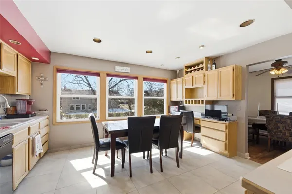 a view of a dining room with furniture window and outside view