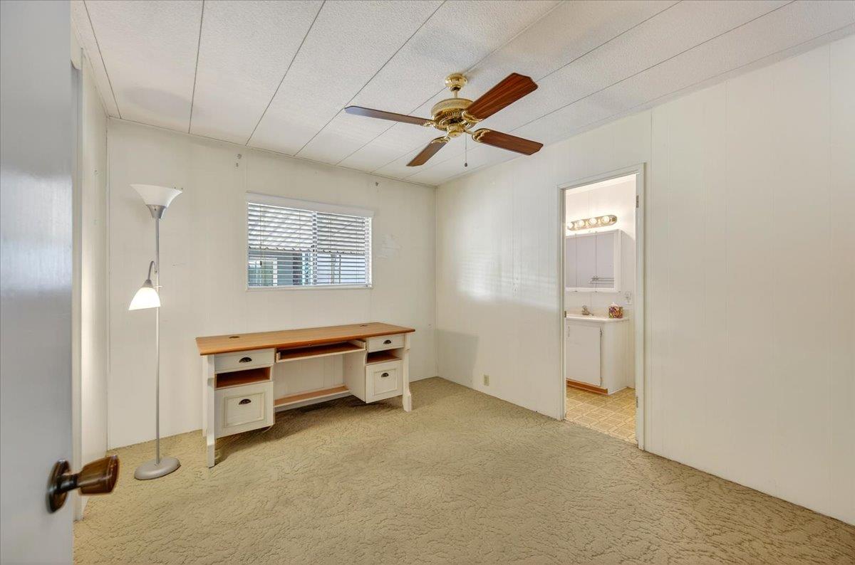 2706 West Ashlan Avenue, Unit 86 Fresno, CA 93705 - Photo 24 of 61 a room with furniture and window