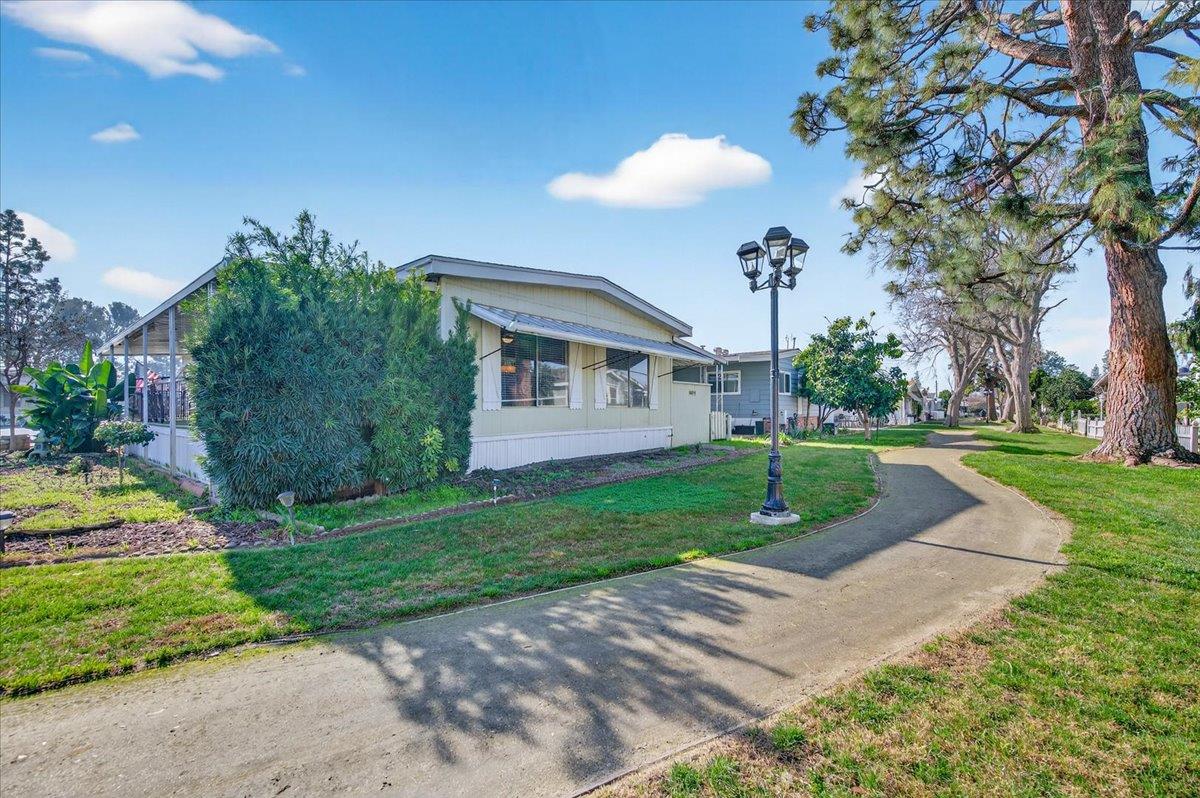 2706 West Ashlan Avenue, Unit 86 Fresno, CA 93705 - Photo 4 of 61 a view of a house with a yard