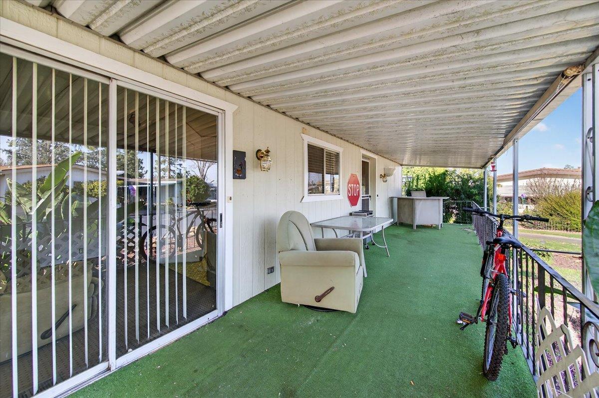 2706 West Ashlan Avenue, Unit 86 Fresno, CA 93705 - Photo 41 of 61 a view of a porch with furniture and garden