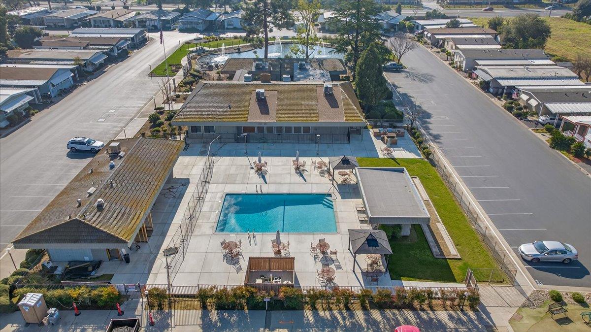 2706 West Ashlan Avenue, Unit 86 Fresno, CA 93705 - Photo 57 of 61 an aerial view of a house with a swimming pool