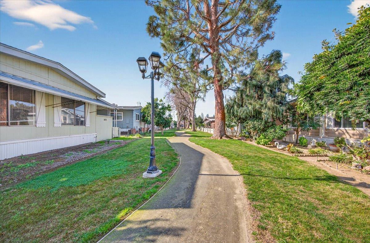 2706 West Ashlan Avenue, Unit 86 Fresno, CA 93705 - Photo 7 of 61 a view of a house with a yard