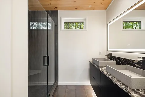 a bathroom with a sink and a mirror