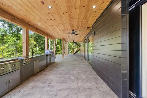 front view of a house with a large swimming pool