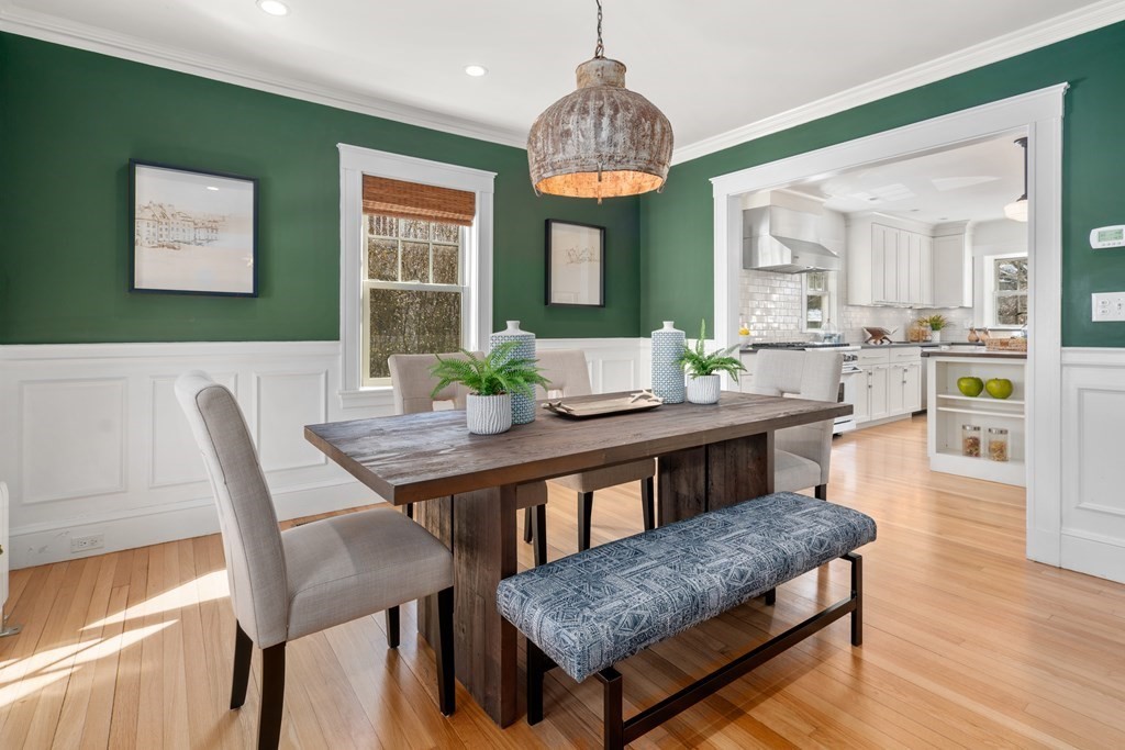 84 Moffat Road Newton, MA 02468 - Photo 13 of 39 a view of a dining room with furniture wooden floor and chandelier