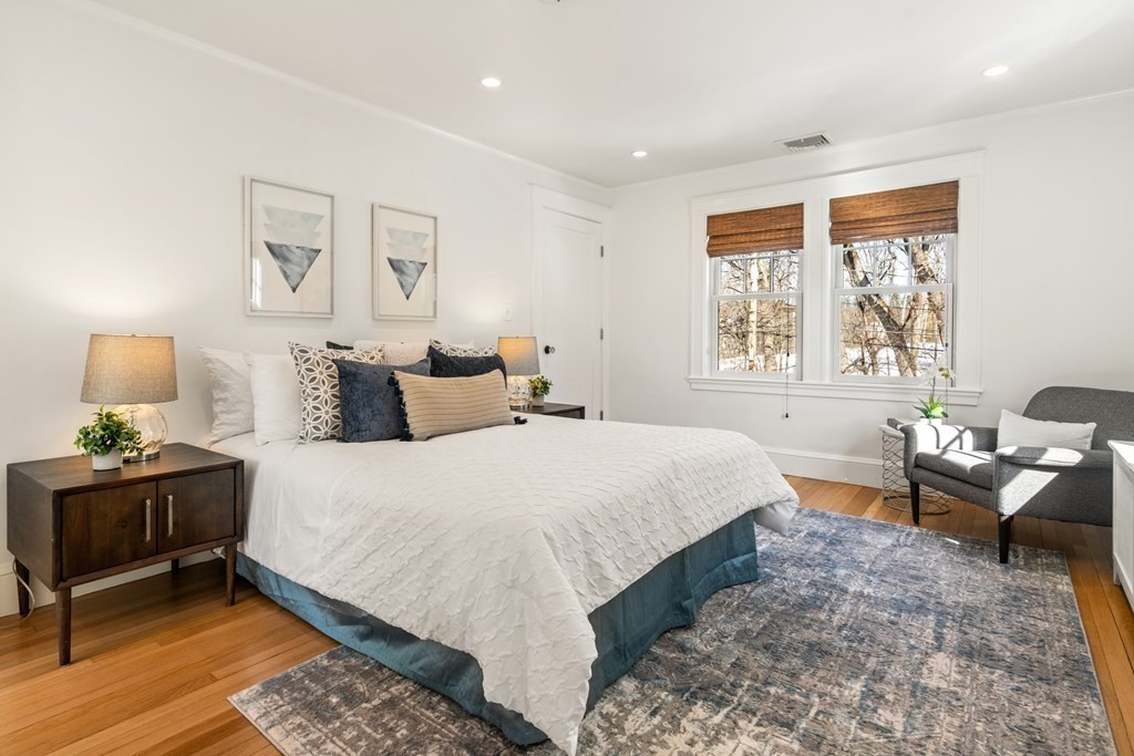 84 Moffat Road Newton, MA 02468 - Photo 23 of 39 a bedroom with a bed and wooden floor
