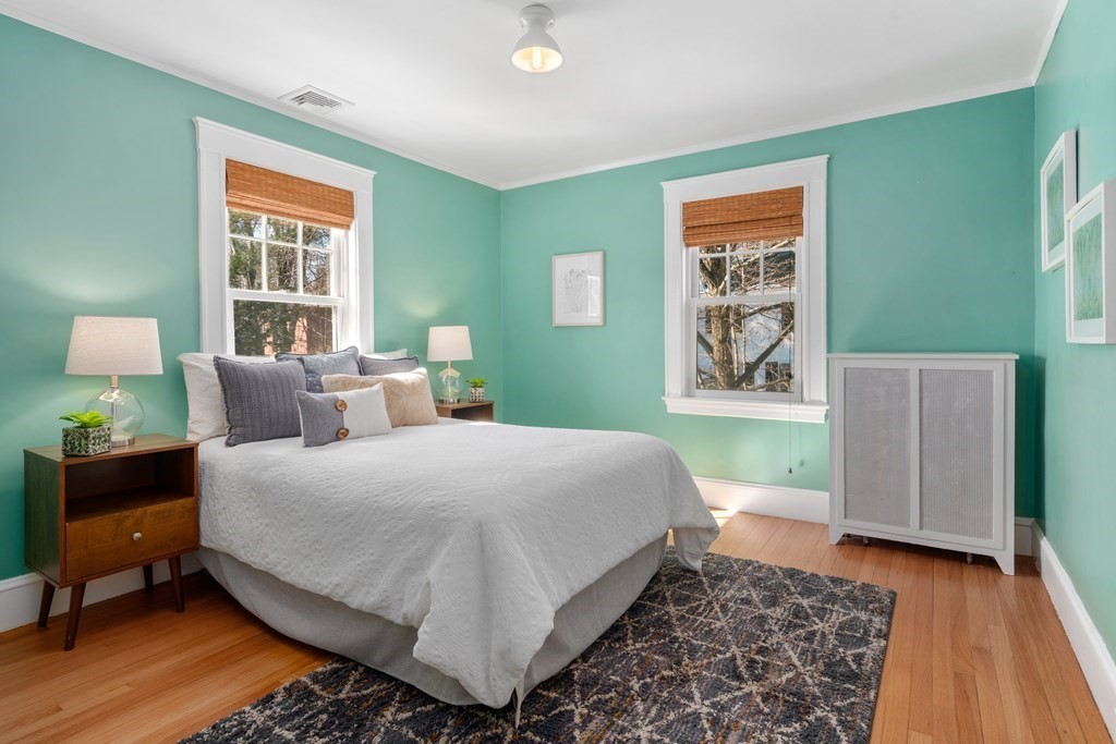 84 Moffat Road Newton, MA 02468 - Photo 26 of 39 a bedroom with a bed and wooden floor
