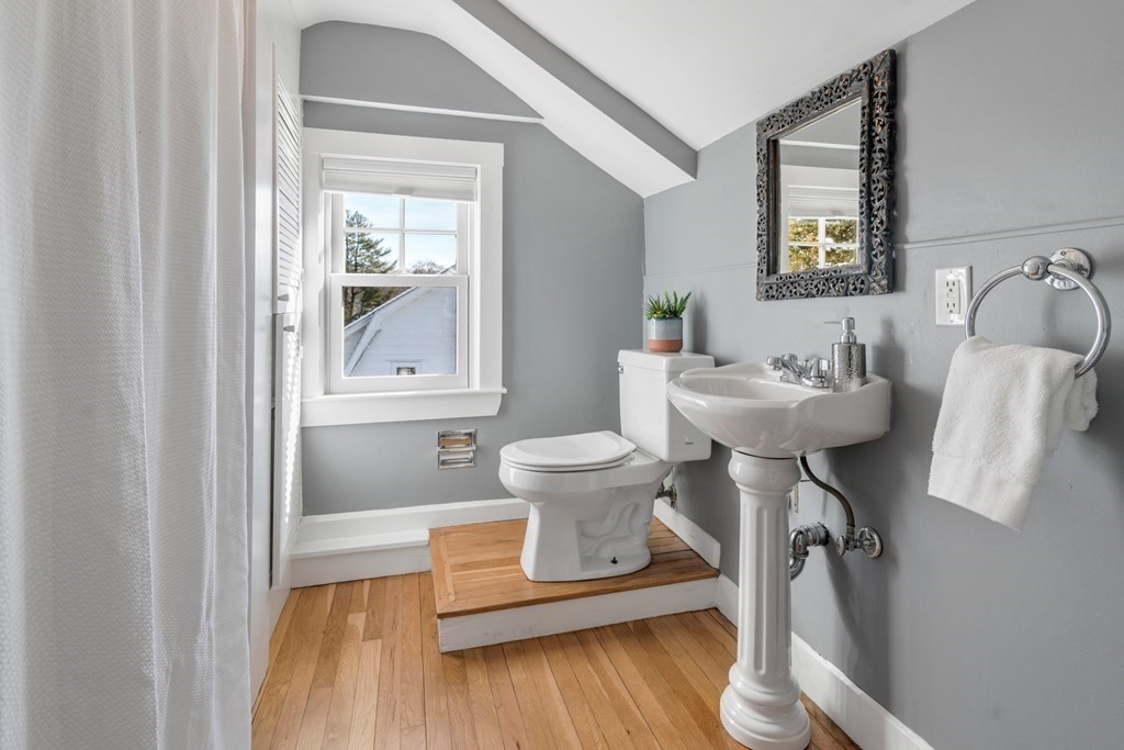 84 Moffat Road Newton, MA 02468 - Photo 29 of 39 a bathroom with a toilet sink and mirror