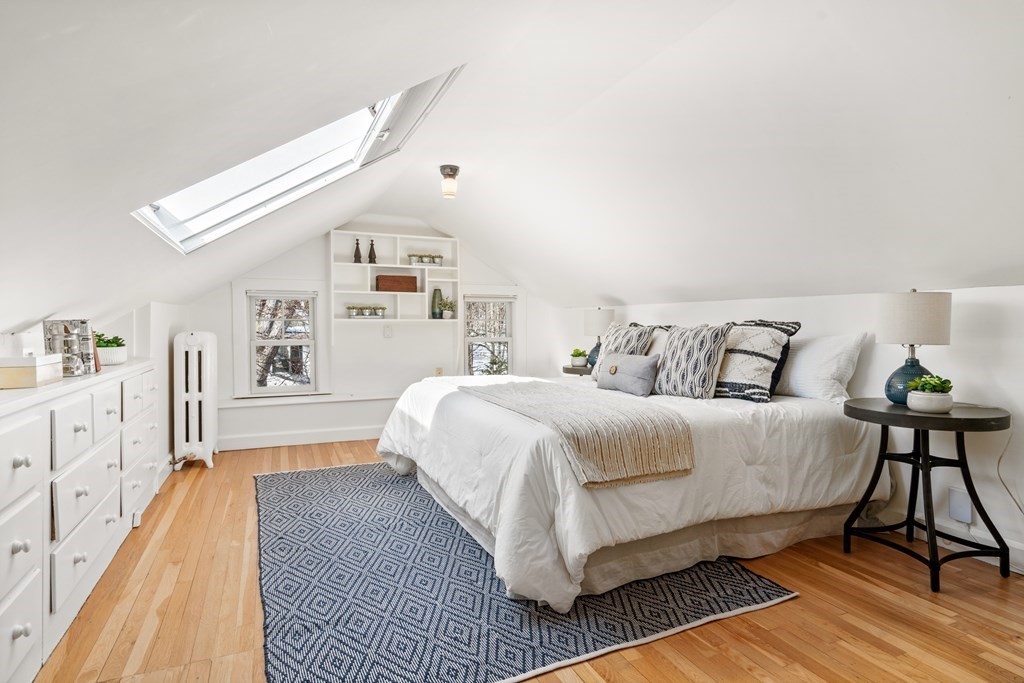 84 Moffat Road Newton, MA 02468 - Photo 30 of 39 a bed room with a bed and a chandelier