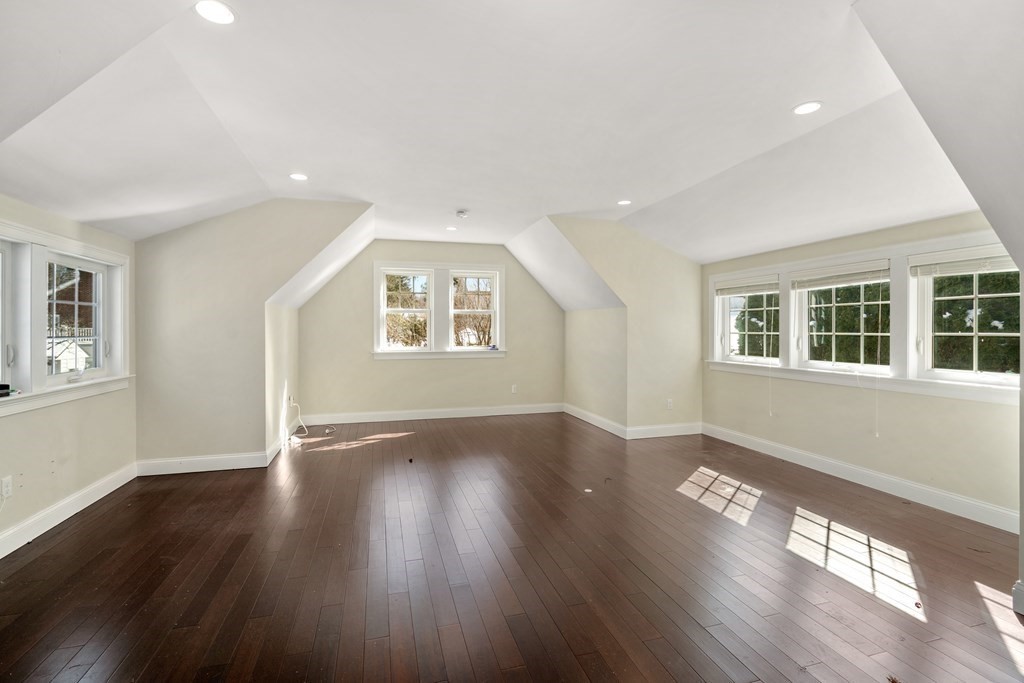 84 Moffat Road Newton, MA 02468 - Photo 35 of 39 a view of an empty room with wooden floor and a window