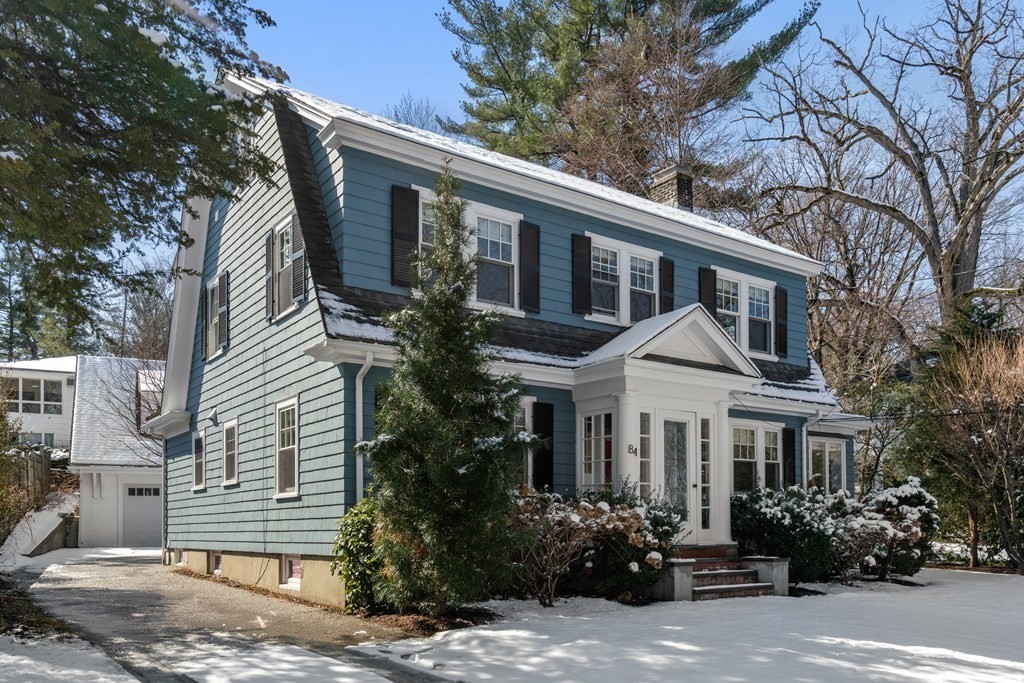 84 Moffat Road Newton, MA 02468 - Photo 5 of 39 a front view of a house with a garden