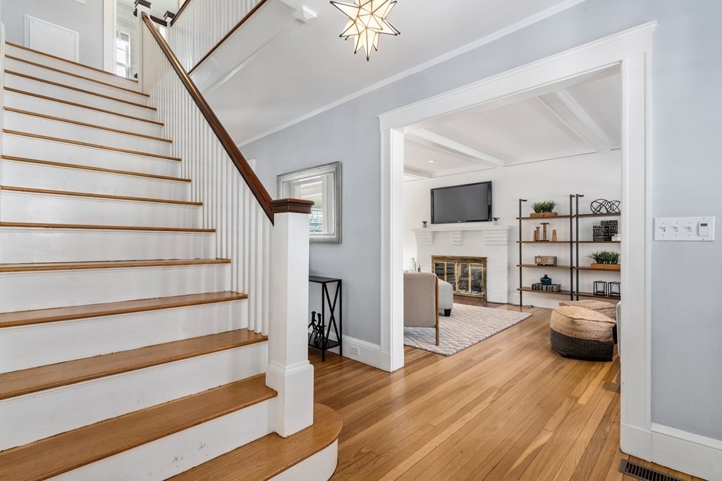 84 Moffat Road Newton, MA 02468 - Photo 6 of 39 a view of a livingroom with furniture and staircase
