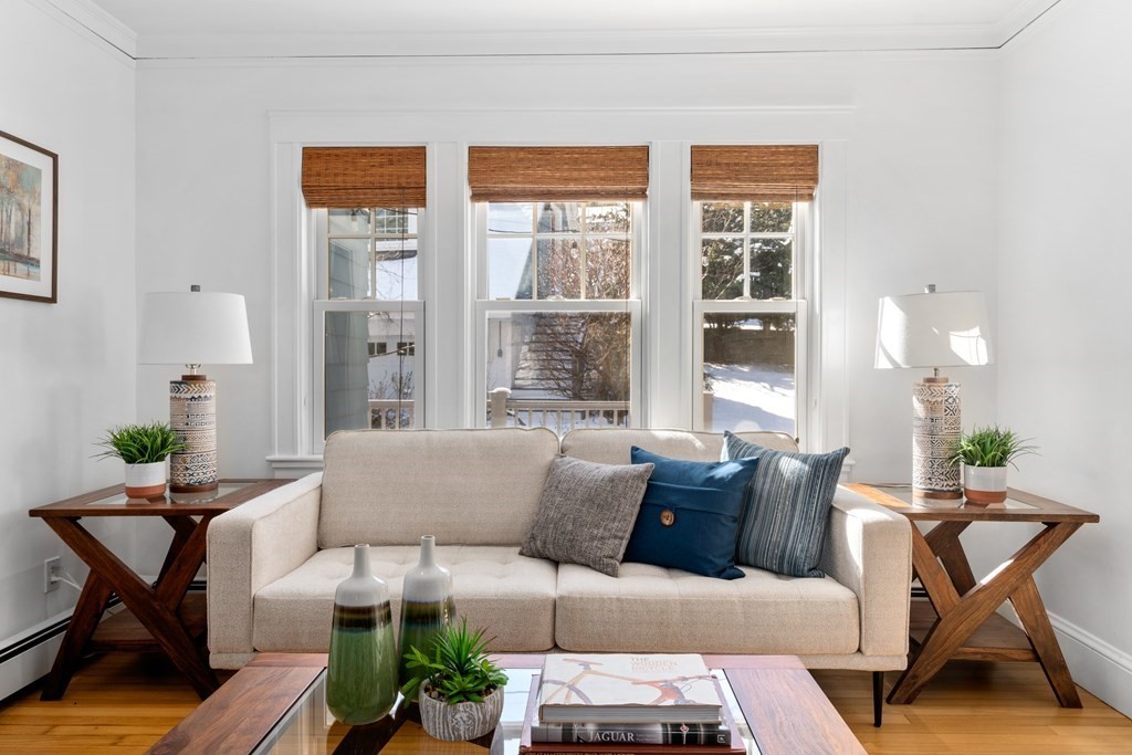 84 Moffat Road Newton, MA 02468 - Photo 7 of 39 a living room with furniture and a potted plant