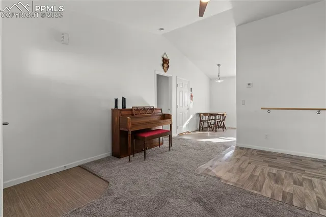 a room with furniture and a piano