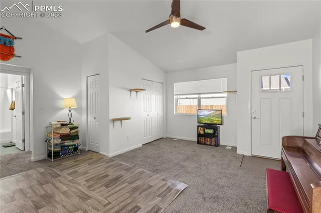 a view of empty room with window and couch