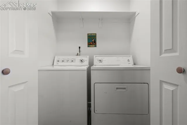 a utility room with dryer and washer