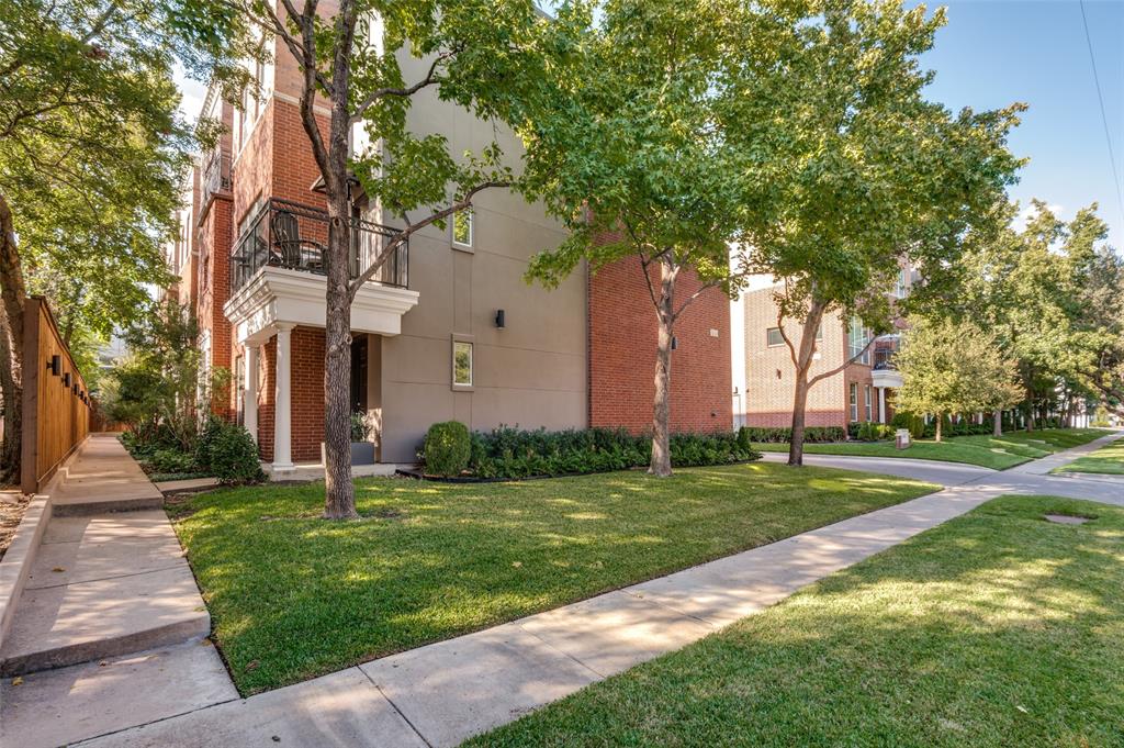 4411 McKinney Avenue, Unit 38 Dallas, TX 75205 - Photo 1 of 1 a front view of a house with a garden and tree
