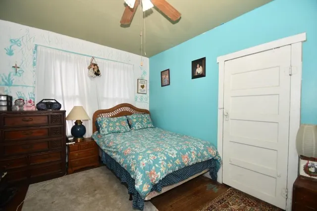 a bedroom with a bed and a cabinets