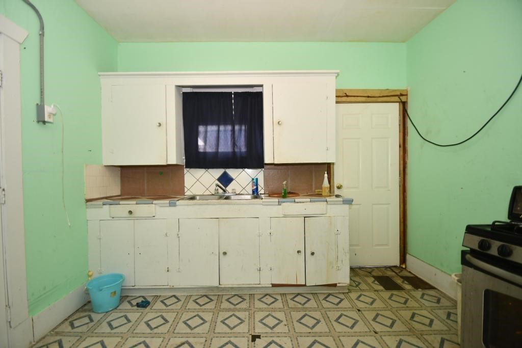 3908 Bering Street Houston, TX 77003 - Photo 21 of 21 a bathroom with a sink and a mirror