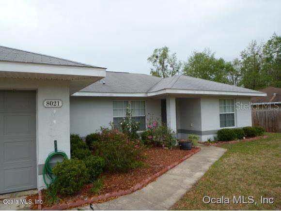 8021 Juniper Road Ocala, FL 34480 - Photo 1 of 1 a front view of a house with garage