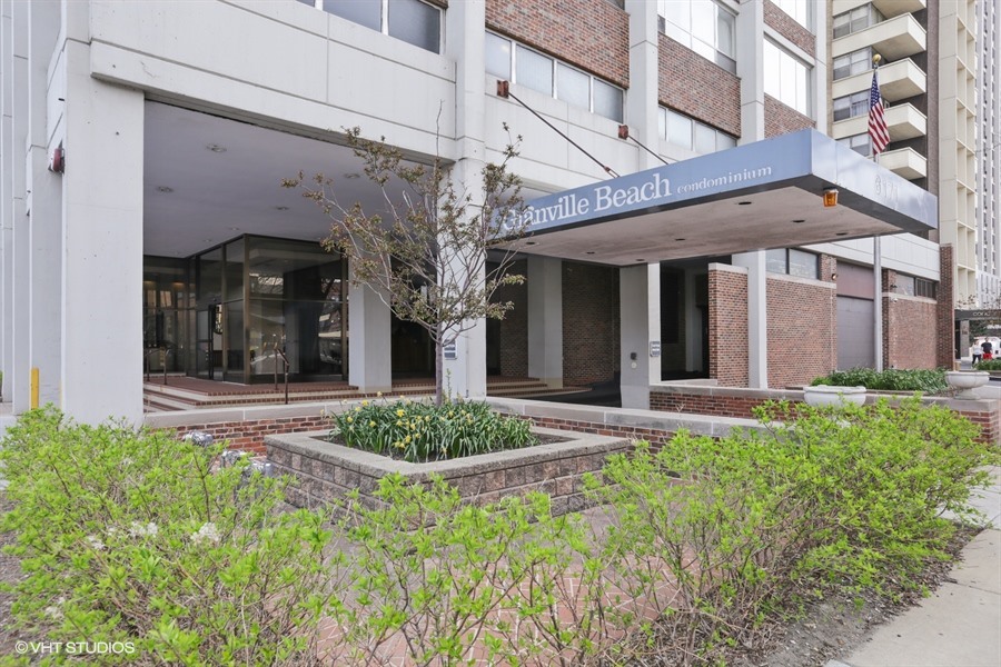 6171 North Sheridan Road, Unit 1107 Chicago, IL 60660 - Photo 1 of 18 front view of a brick house with a large windows