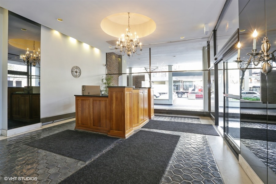 6171 North Sheridan Road, Unit 1107 Chicago, IL 60660 - Photo 2 of 18 a view of a hallway with wooden floor